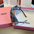 CHANEL BOW HEADBAND IN BLUE DAMIER DENIM 398855