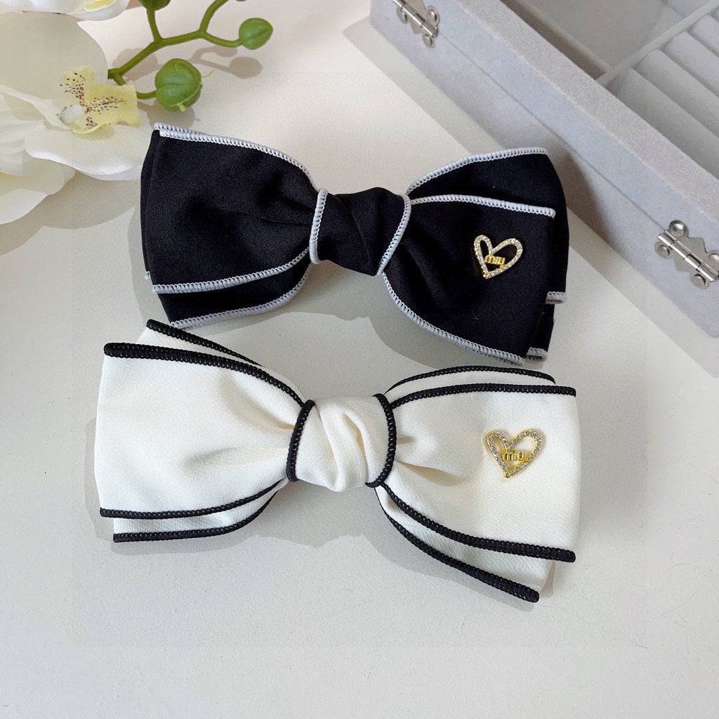 CHANEL BOW HAIRPIN IN WHITE AND BLACK TRIM COTTON 406023