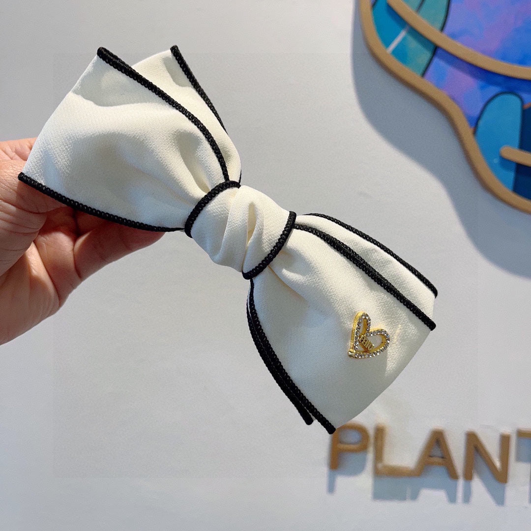 CHANEL BOW HAIRPIN IN WHITE AND BLACK TRIM COTTON 406023